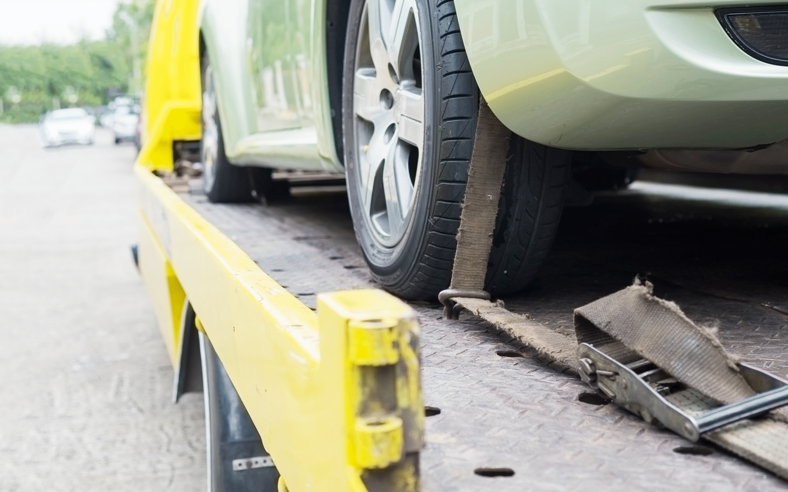 car-transporter-breakdown-lorry-working-using-locked-belt-transport-other-green-car 1